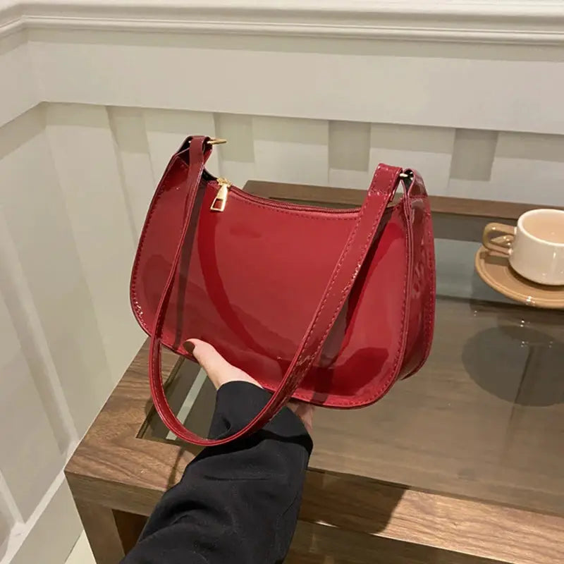 Red patent PU leather shoulder bag by Simples Market with gold-tone hardware