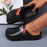 Black EVA slides with buckle straps and charm tags; waterproof indoor/outdoor footwear for women (2 shown)