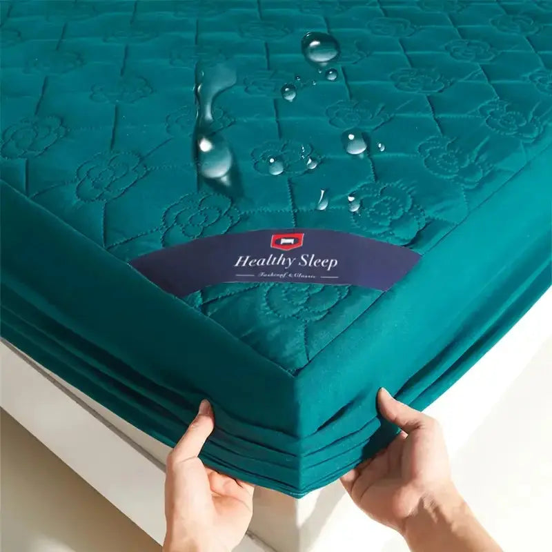 Teal waterproof fitted mattress protector with deep pocket for single or double bed.