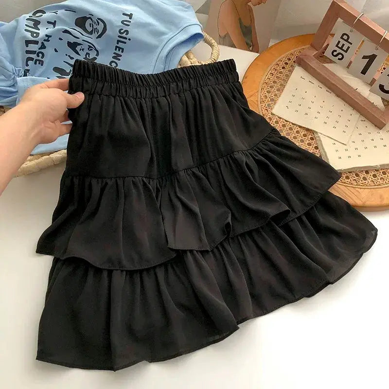 Mini skirt by Simples Market: black tiered high-waist with layered ruffles