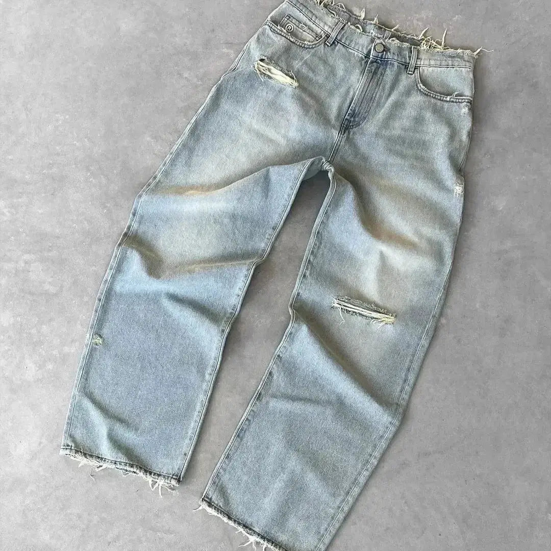 Men's straight distressed denim jeans in light wash with ripped holes, zipper fly, ankle-length.