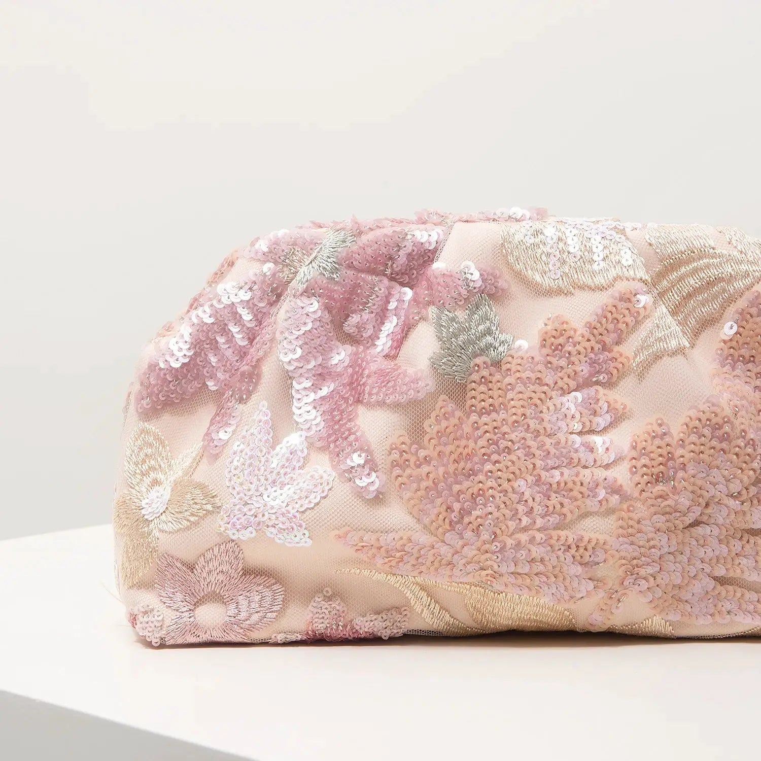 Clutch bag with pink sequin floral embroidery on blush base