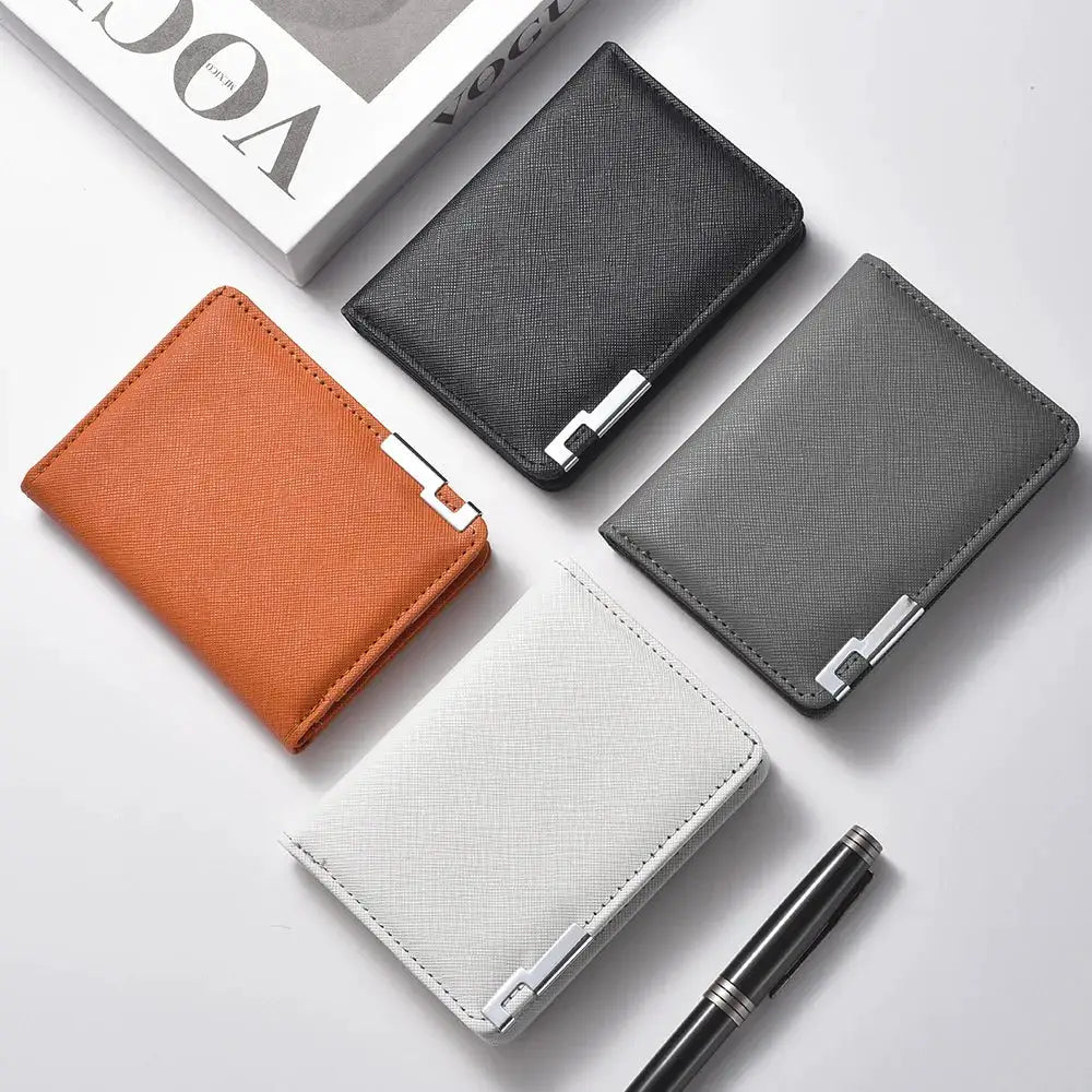 Set of four small slim wallets in black, gray, orange and white faux leather with geometric texture and silver hardware