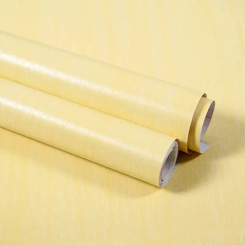 Three vinyl self-adhesive wallpaper rolls with pale yellow wood grain pattern for walls and furniture.