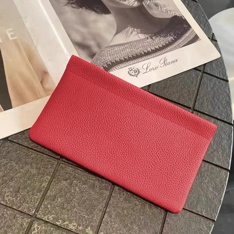 Red faux-leather long wallet with pebbled texture for cards and IDs