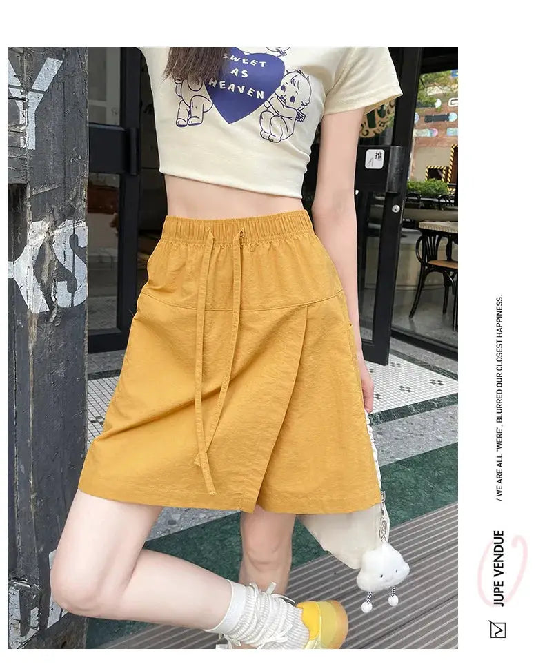 Mustard yellow high-waist shorts-skirt with drawstring and side slit; lightweight mini skirt for women