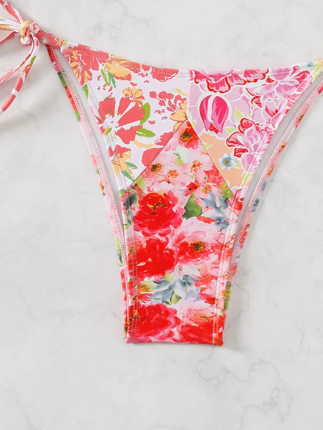 Floral print triangle bikini bottom with pink side ties, Brazilian cut