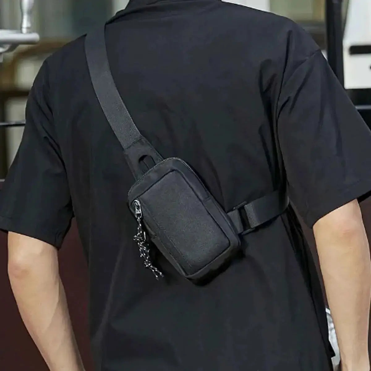 Men's Oxford small crossbody bag in black with front zip pocket and adjustable strap