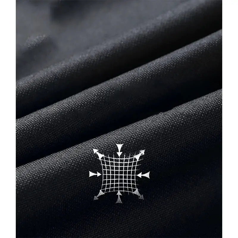 Men's black jogging pants fabric close-up with white grid emblem