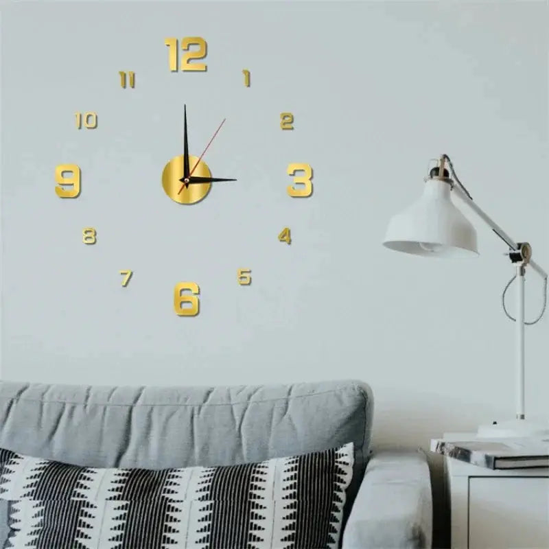 Luminous wall clock with gold 3D numerals on a pale gray wall above a sofa and a white floor lamp.