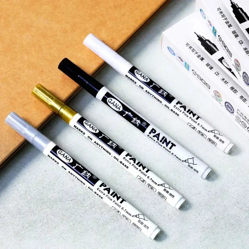 GANA paint marker set, 4-piece oil-based pens with white/black/gold/gray caps, 0.7mm extra-fine, waterproof