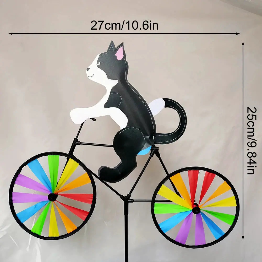 Animal riding wind spinner on a standing pole with colorful rainbow wheels for garden decor.