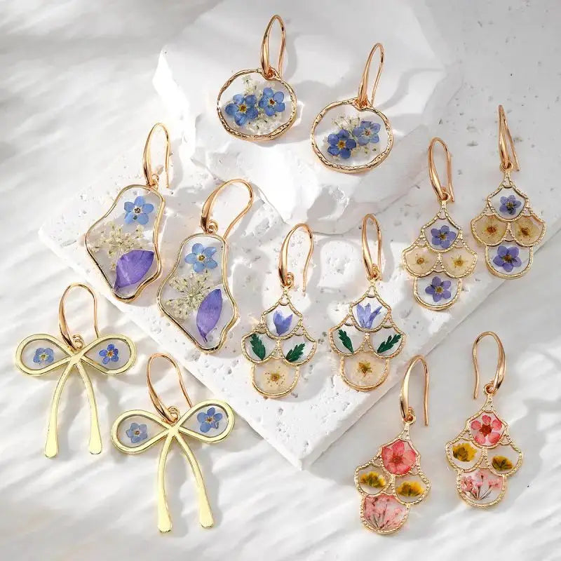 Assorted natural flower dangle earrings in gold-tone epoxy frames; colorful pressed flowers, set of 15 pairs
