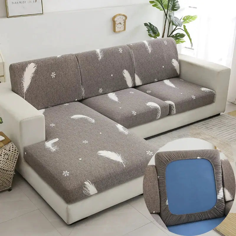 Simples Market floral stretch sofa slipcover for L-shaped chaise, gray with white feather prints