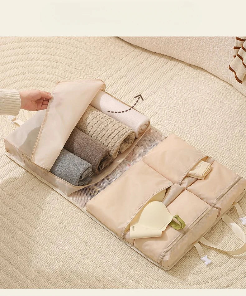 Business Travel Storage Hanging Bag by Simples Market; beige, foldable clothing organizer with rolled garments