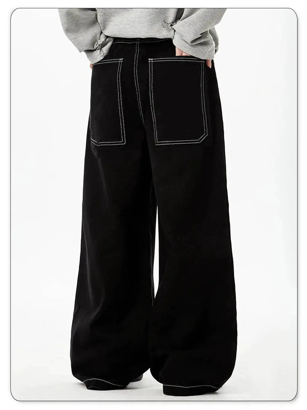 Black baggy wide-leg denim jeans with white contrast topstitching and large back pockets.