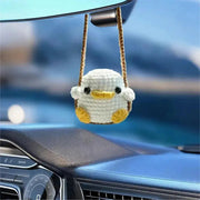 Simples Market duck frog crochet car pendant, white with yellow beak and feet, hanging from rearview mirror