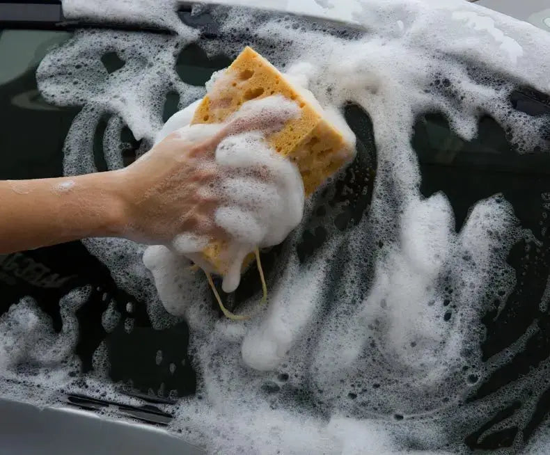 Car wash sponge block by Simples Market, large yellow honeycomb sponge used to wash a car.