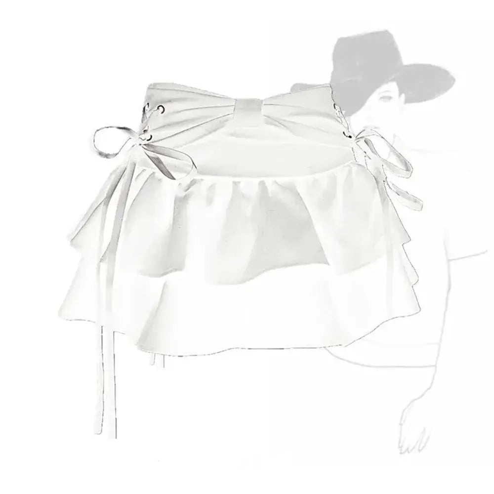 White top with oversized bow ties and a ruffled hem, decorative shoulder ties.