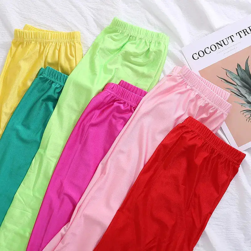 Women's shiny high-elastic skinny leggings set in six colors: yellow, teal, lime, magenta, pink, red for a tight fit