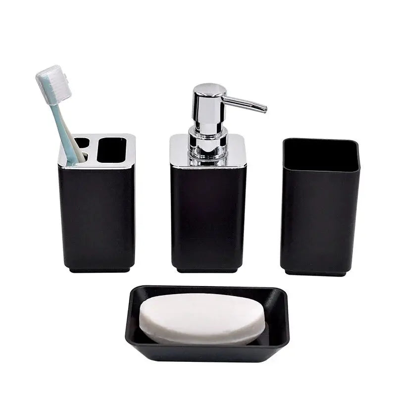 Black plastic bathroom storage set with chrome accents; toothbrush holder, lotion pump, cup, and soap dish.