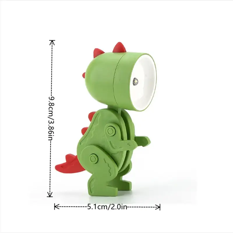 Dinosaur-shaped mini LED night light; green body with red spikes, kid-friendly desk lamp.