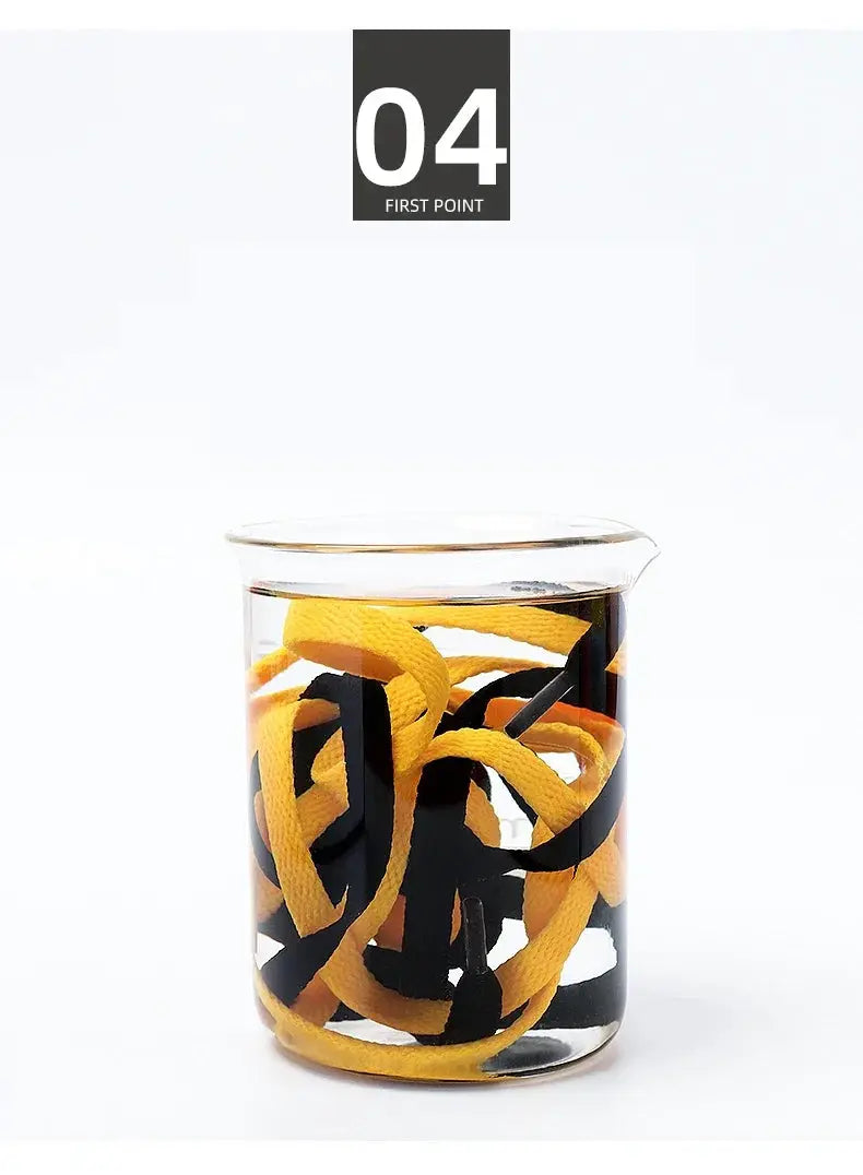Flat shoelaces, 1 pair in a glass jar, yellow with black accents