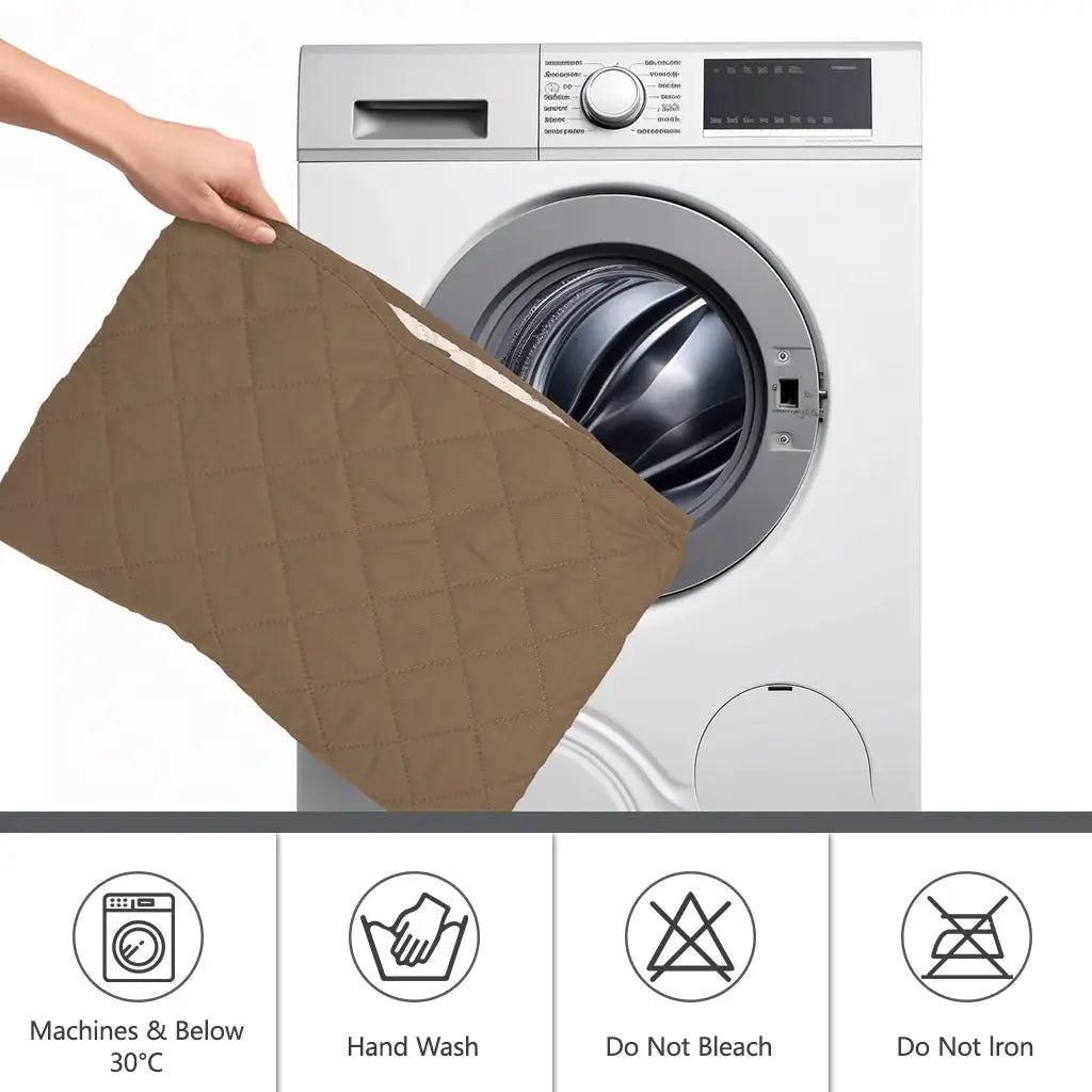 Quilted brown sofa cover being loaded into a washing machine; machine washable