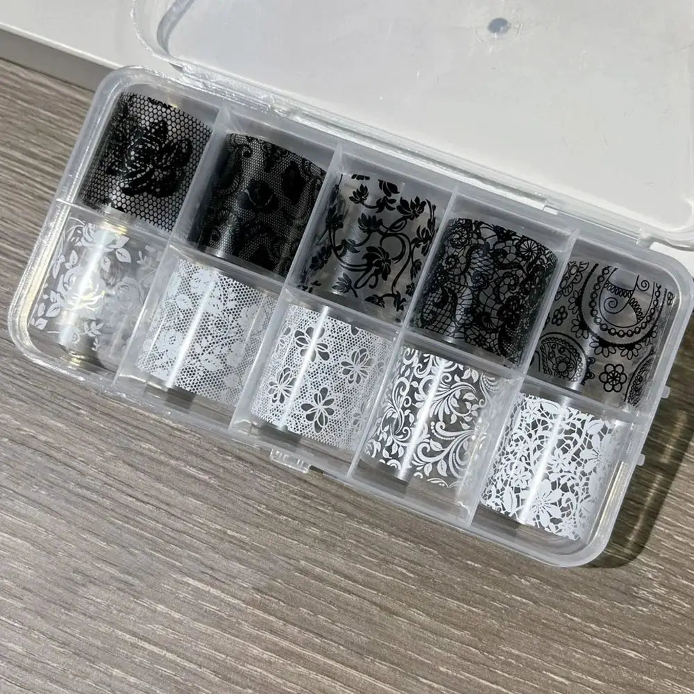 Nail transfer sticker set with 10 black and white lace full-wrap rolls in a clear case