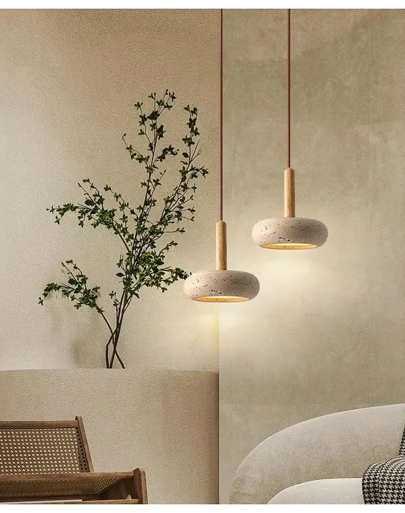 Pendant lamp set: two circular yellow stone LED pendants with wooden stems.