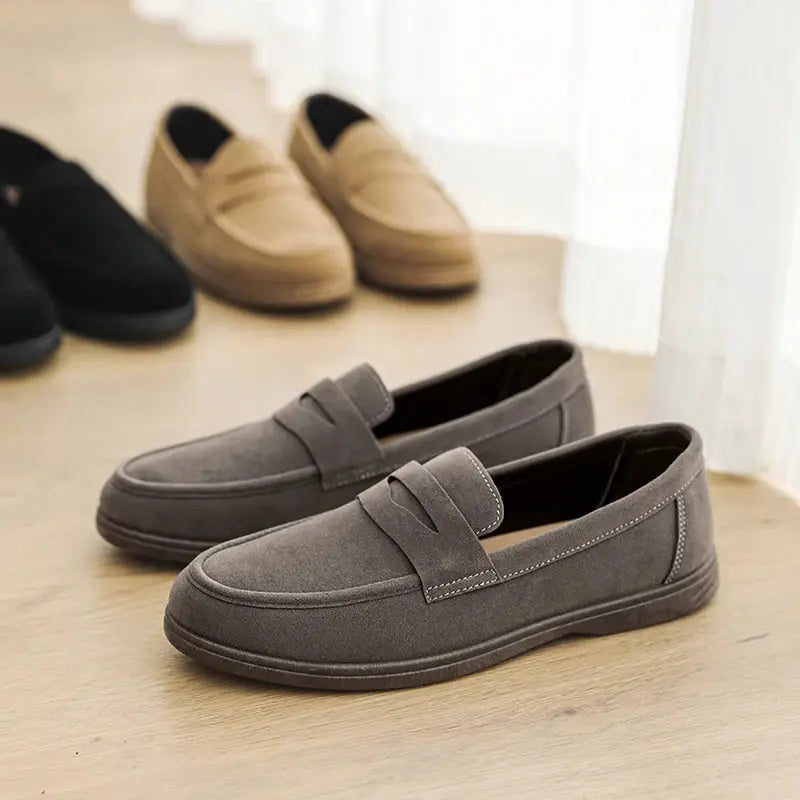 Simples Market gray suede men's slip-on loafers with penny strap; background shows black and beige color options