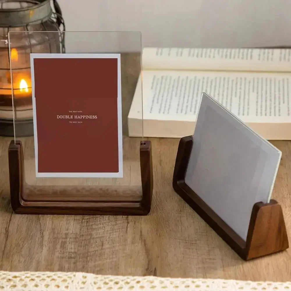 Walnut/beech acrylic U-shaped photo frame on wood desk; 2 frames shown, one upright with card, one angled.