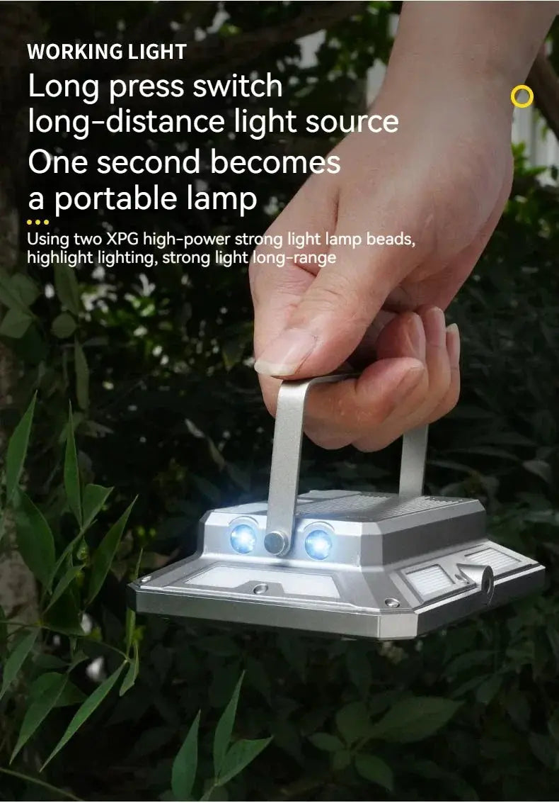 Simples Market LED camping tent light handheld with silver metal body and dual blue LEDs; rechargeable outdoor lamp.