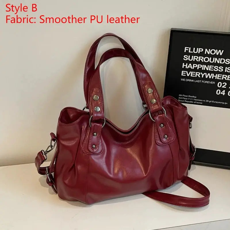 Women's burgundy PU leather shoulder bag with dual top handles and removable strap
