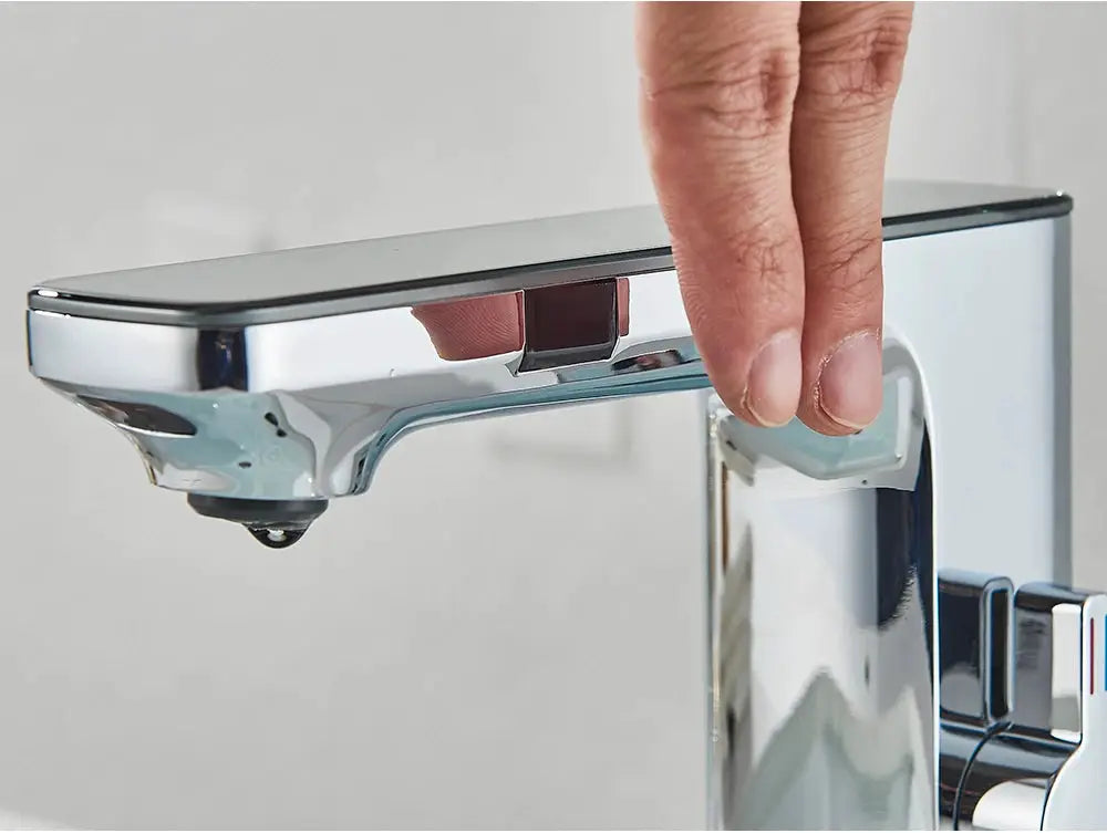 White smart sensor basin faucet with digital display, chrome finish, touchless operation.