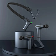Long-handle electric massage gun by Simples Market; dark metallic blue with interchangeable heads and charging stand