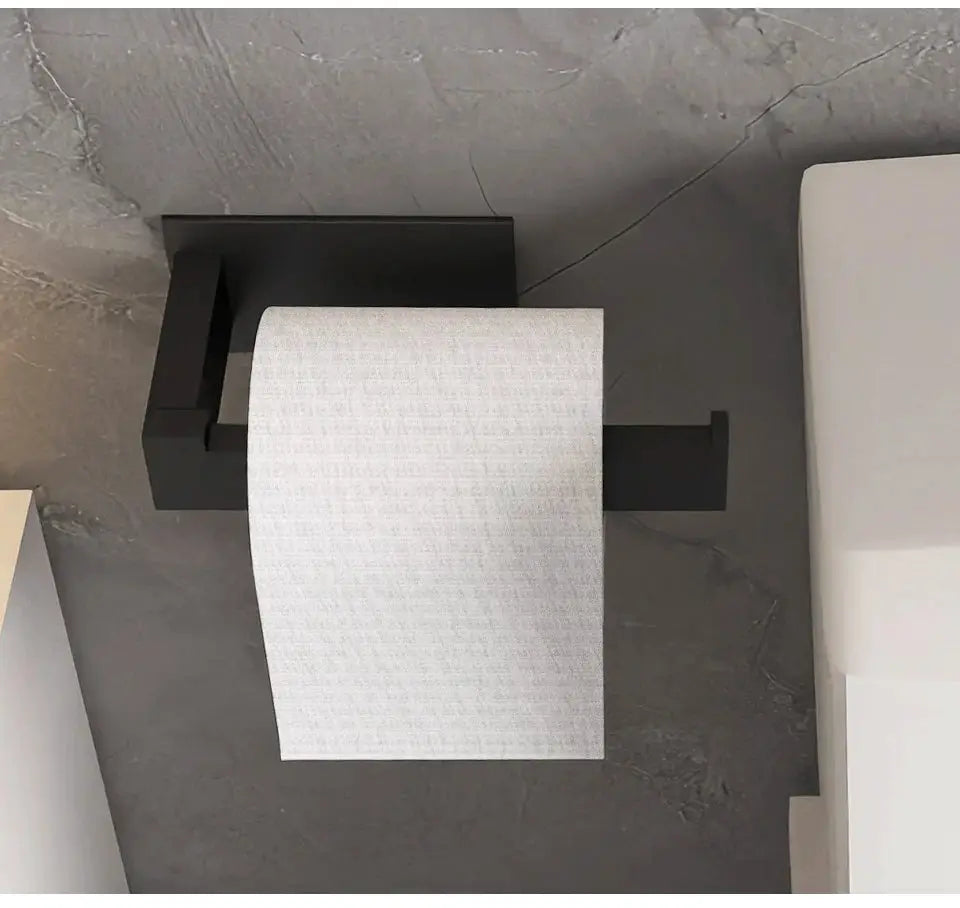 Black bathroom hardware set by Simples Market; self-stick robe hook, towel bar, and paper holder.