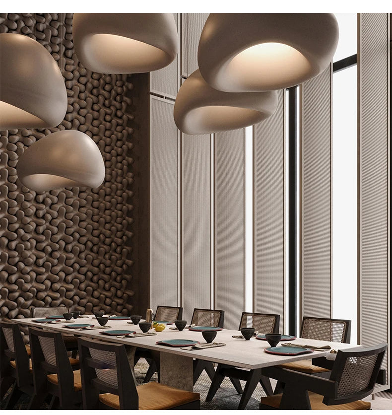 Nordic Wabi Sabi pendant lights by Simples Market, cream ceramic pods hanging over a modern dining table.