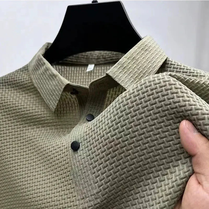 Men's bone-colored short-sleeve polo shirt with textured woven pattern on hanger