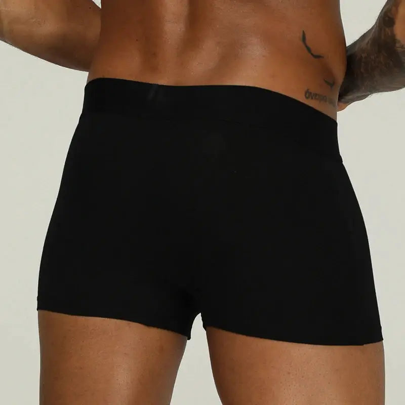 Men's black cotton boxer briefs, back view with snug fit
