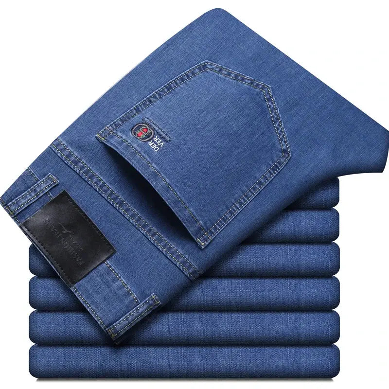 Simples Market men's blue denim jeans with back pocket and leather patch; elastic stretch casual trousers.