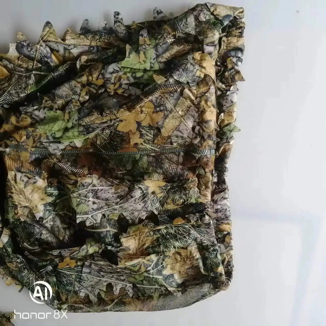Ghillie suit camouflage outfit with hooded jacket and pants in leaf-pattern jungle camo