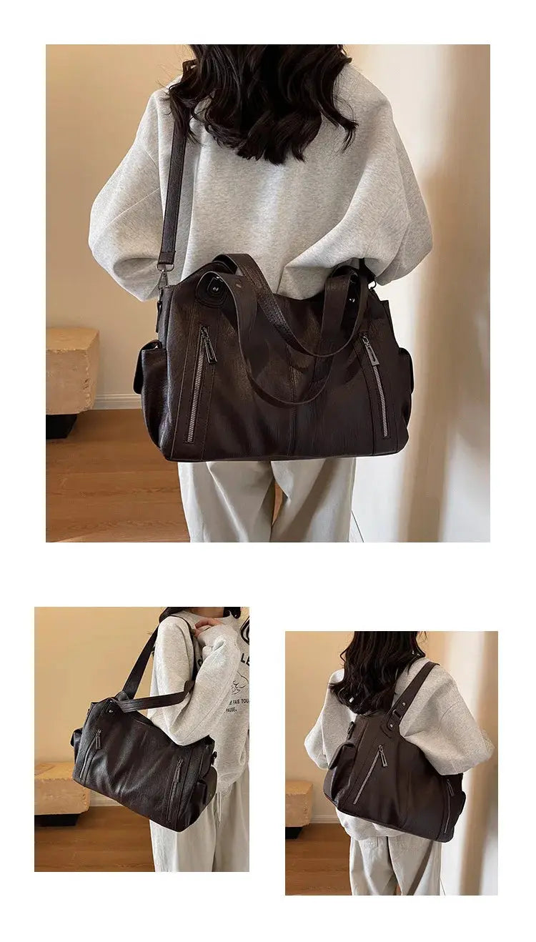 Brown PU leather shoulder bag with top handles and crossbody strap, featuring front zipper pockets