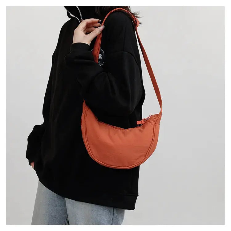Nylon crescent crossbody bag in orange with zipper closure, Simples Market, large-capacity dumpling-style bag
