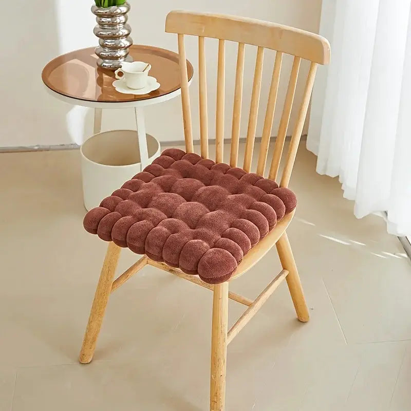 Large biscuit-shaped plush chair seat cushion; soft brown tufted pillow for a wooden chair
