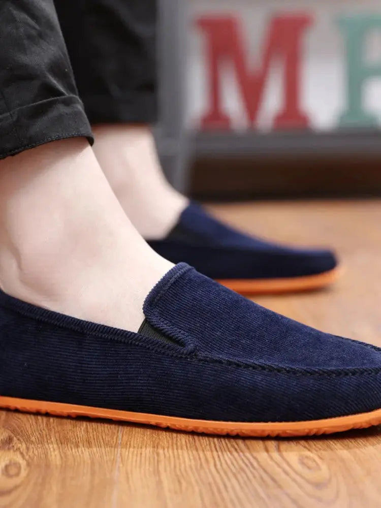 Men's navy fabric loafers by Simples Market with orange sole