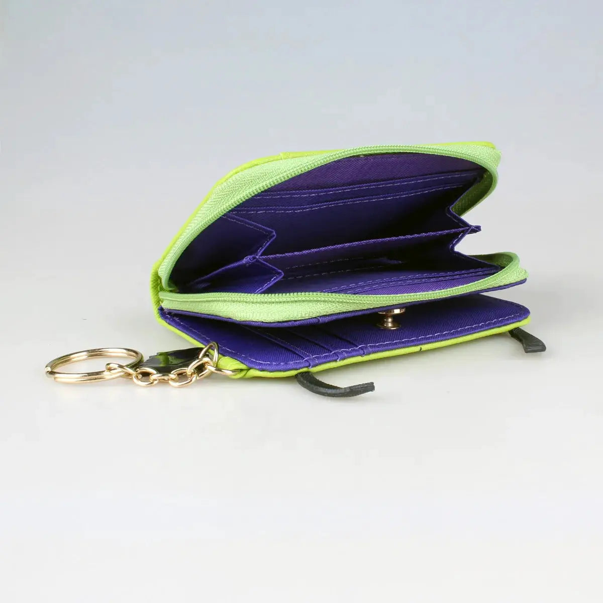 3D stereo trifold wallet by Simples Market with lime exterior, purple interior, ID window, and gold keyring