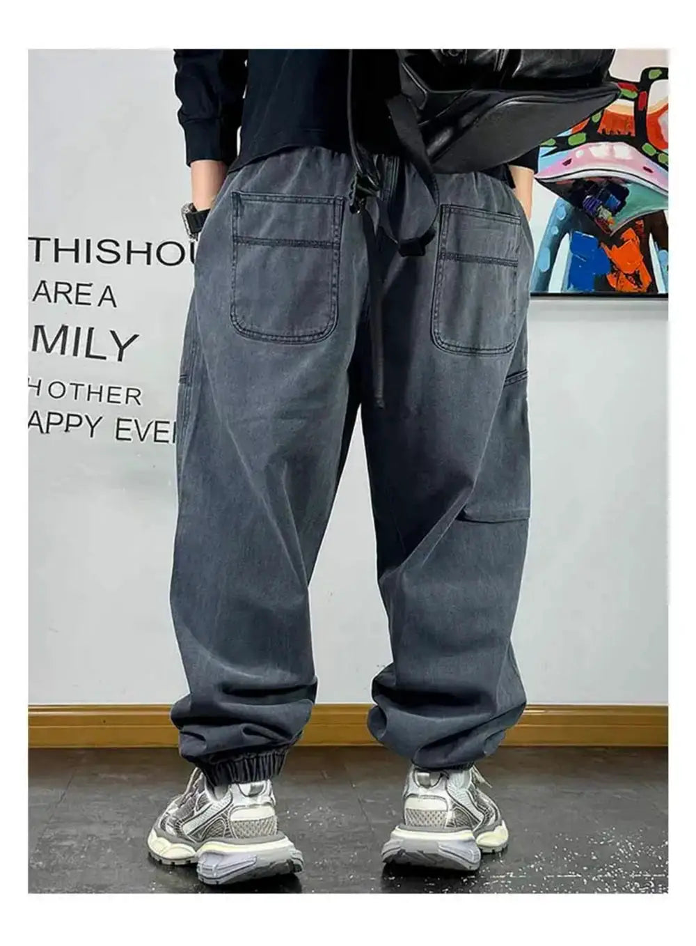 Baggy cargo pants in dark gray denim, Japanese streetwear style with large back pockets and elastic cuffs