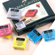 Faber-Castell eraser set with kneaded and plastic erasers in assorted colors on a black box