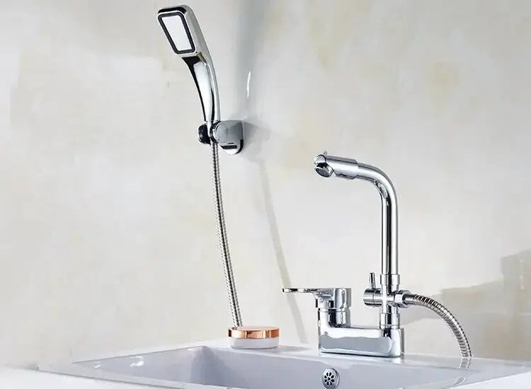 Chrome basin shower faucet with single-handle deck-mounted mixer valve and handheld sprayer.